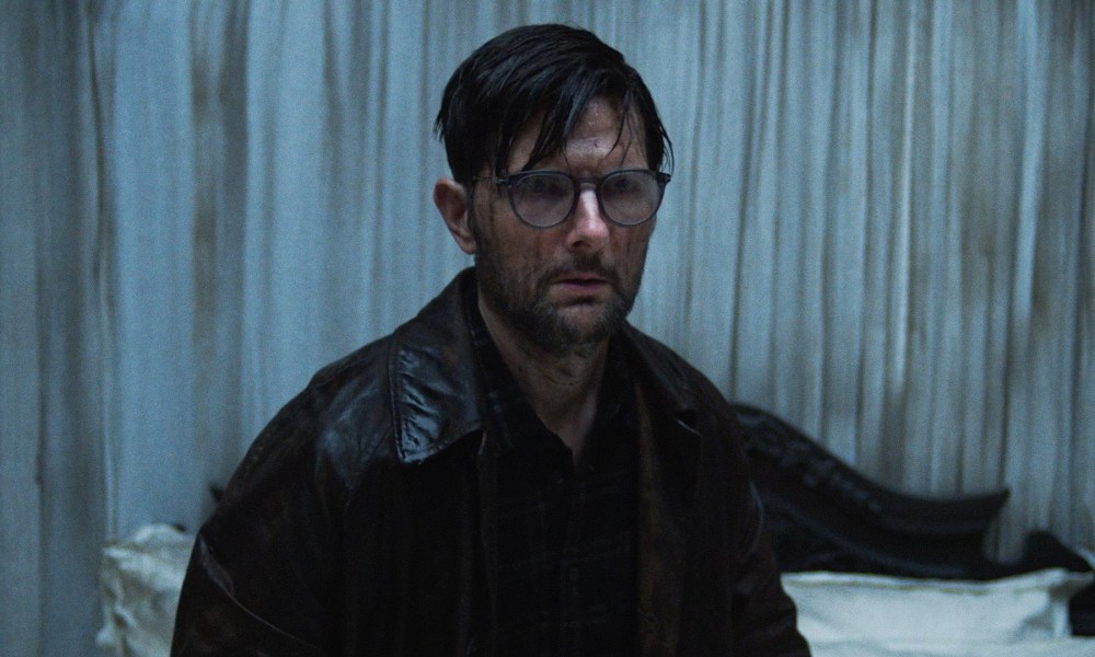 ‘Hokum’ First Look – Adam Scott Stars in NEON Horror Movie from the Director of ‘Oddity’