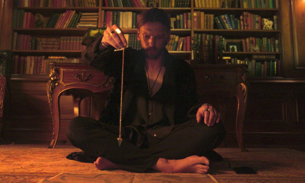 Jamie Campbell Bower Gets Cut Throat in ‘Witchboard’ Exclusive Clip