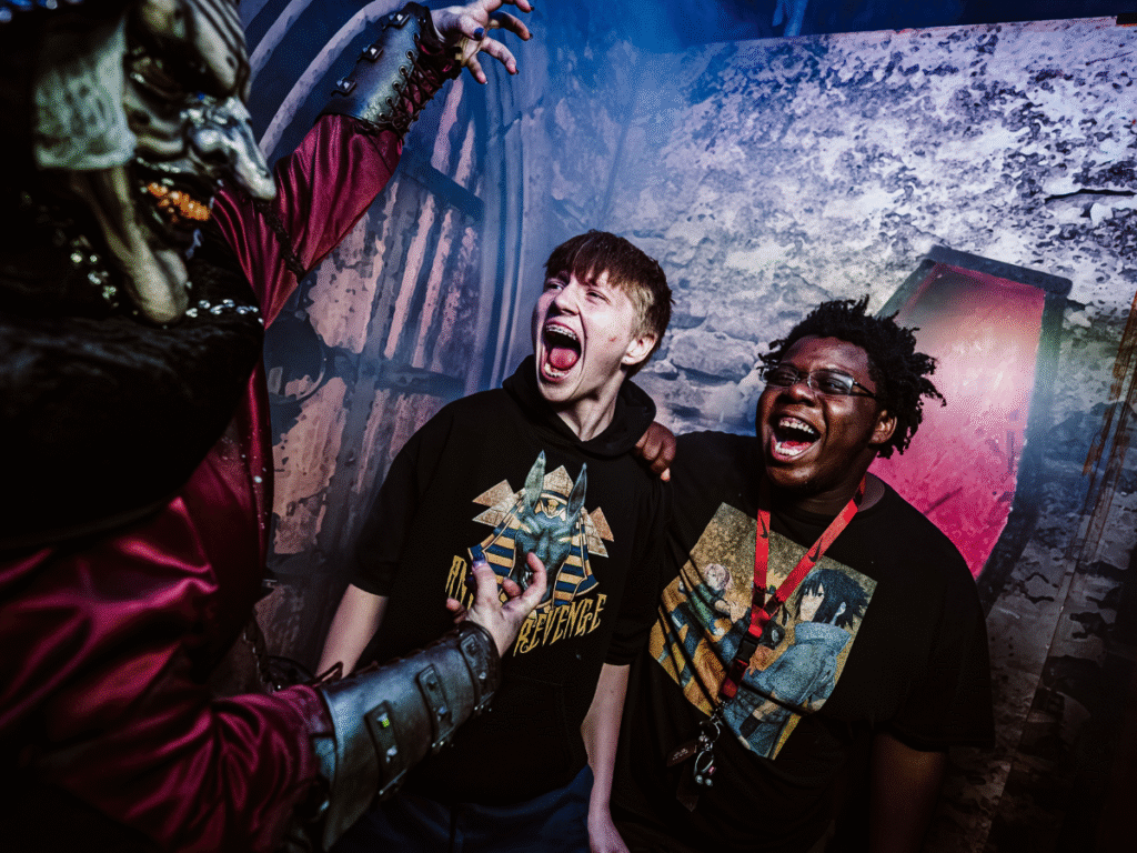 Two guests being frightened by monster