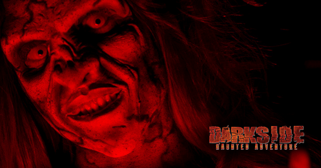 Darkness Rising Haunted Adventure logo with monster