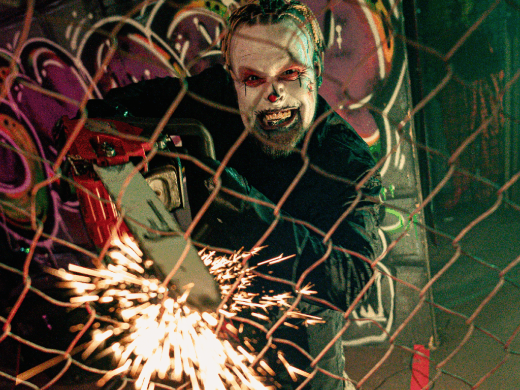 Psycho clown with chainsaw